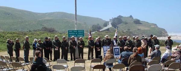 The State Park Rangers and State Park Lifeguards assemble beneath the memorial highway sign, June 1, 2013 at San Gregorio State Breach, California. Photo © Mobile Ranger 2013.