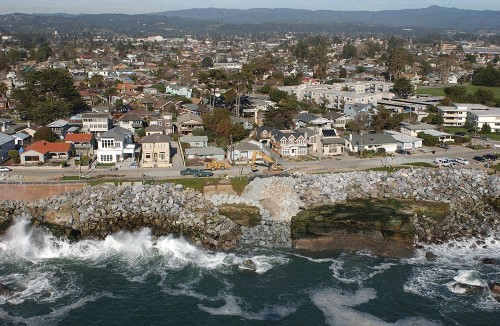 A view from the mountains to the eroding coast along West Cliff Drive in 2010. Picture © Kenneth and Gabrielle Adelman, California Coastal Records Project www.Californiacoastline.org.