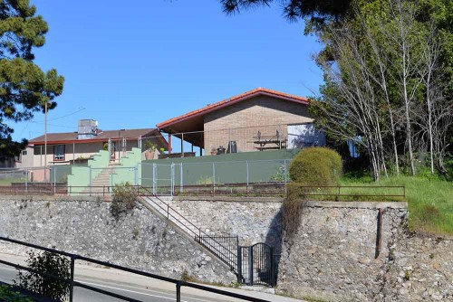 Holy Cross School today. The steps to Holy Cross school are gated now. There is another staircase up to the Mission Adobe park which is also closed. 