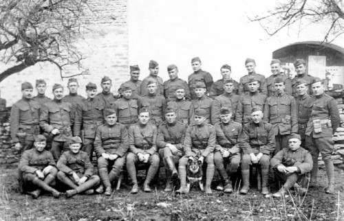Officers and men of the 135th Aero Squadron with their mascot "Rin Tin Tin" shortly after his rescue as a puppy in 1918. Photo from Bwmoll3.