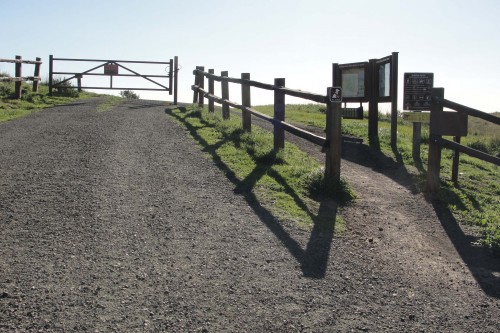 A trail entrance to the Russian Ridge Open Space Preserve across from the vista point, March 2015. Photo © Janet Schwind.