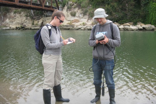 Coastal Watershed Council volunteers and staff record water quality measurements taken at the San Lorenzo river mouth in May 2014. Photo courtesy and © of the Coastal Watershed Council.