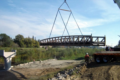 The new pedestrian bridge is lowered into place in 2009. Photo courtesy and © of Syblon Reid General Engineering Contractors.