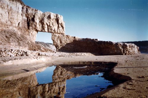 Doon Beach with its natural bridge  circa 1975. Photo: From the collection of Paul and Carmen Mulholand via Tom Scully