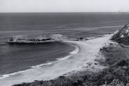 Historic photo of Greyhound Rock. The beach shows much more sand than it typically has these days (in winter or summer). LAUREN CAN YOU GET DATE FROM YOUR MAH NOTES?